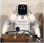 I wonder if he used his finger-hinges to adjust the microphone towards is vacuuous black-hole of a 'face'.