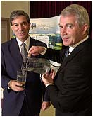 Premier Binns and Minister of Environment Gillan enjoying a crystal clear class of warm-blooded animal feces